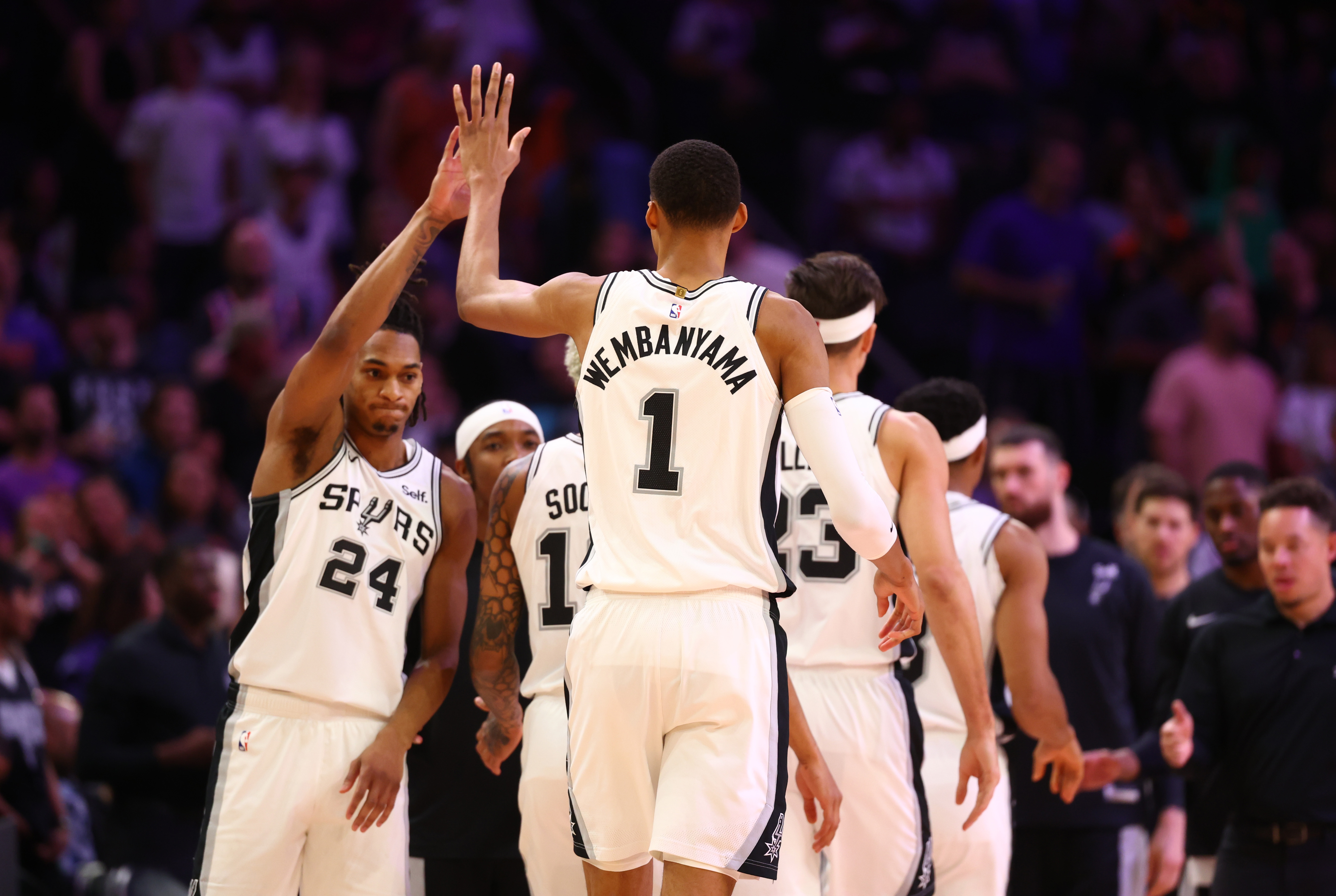 Nov 2, 2023; Phoenix, Arizona, USA; San Antonio Spurs center Victor Wembanyama (1) celebrates a dunk with teammates against the Phoenix Suns in the first half at Footprint Center.